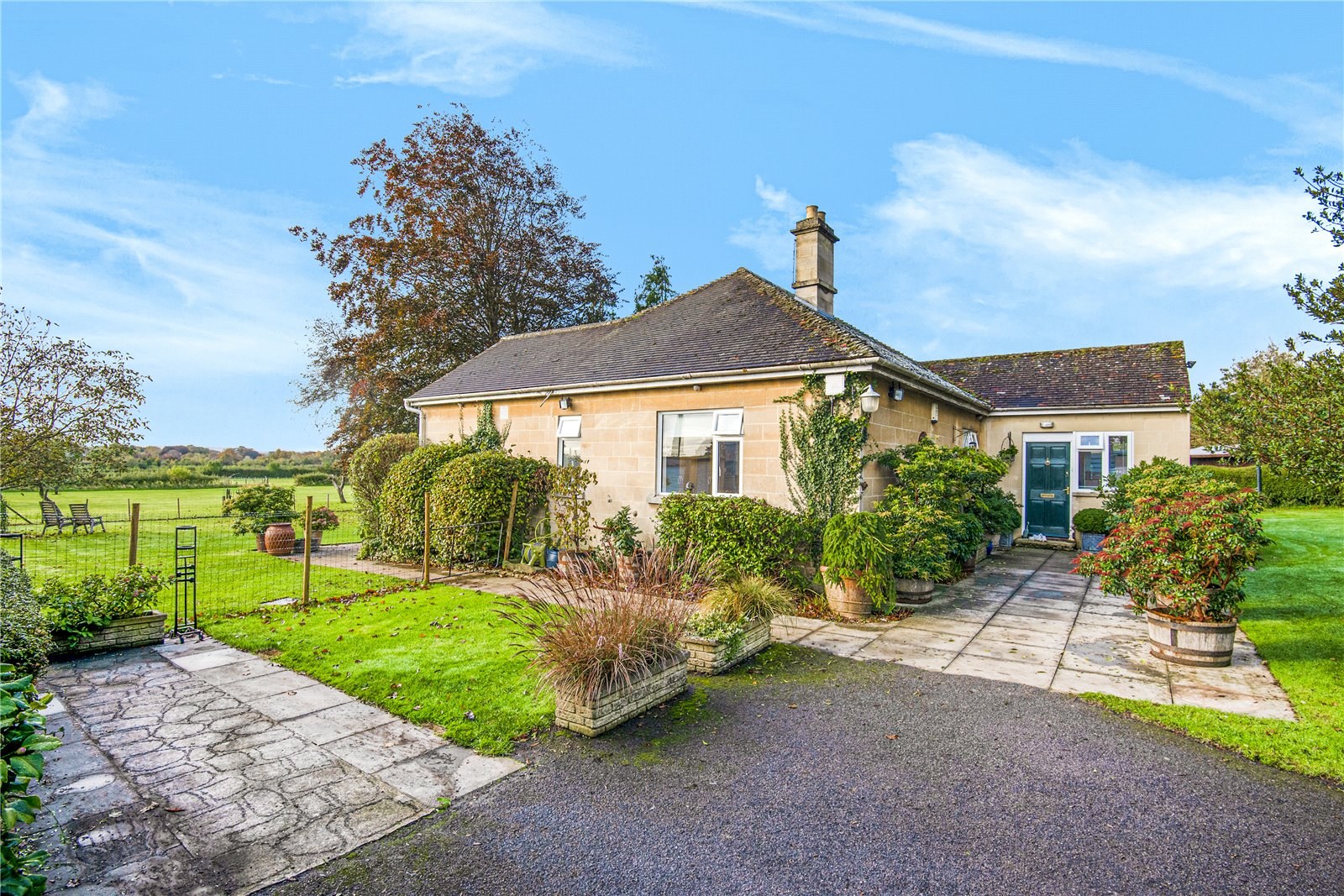 A two/three bedroom bungalow with just under 8 acres of land and planning permission to extend the ground floor while incorporating bi